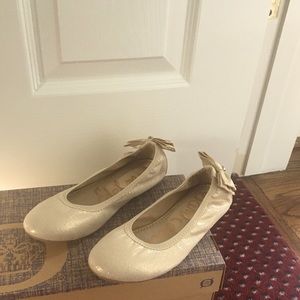 Girls’ glittery slip on shoes.